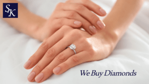 hands folded diamond engagement ring left hand